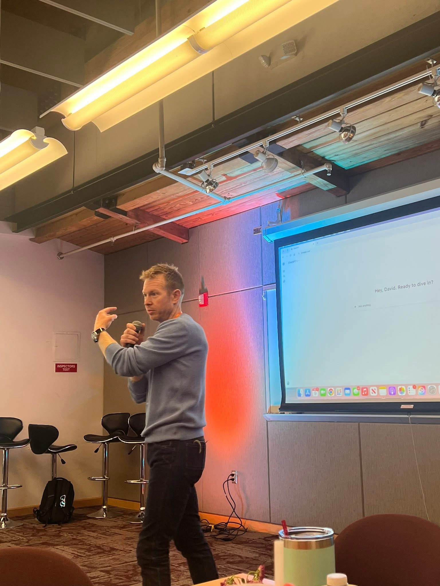 David Colgan speaking with microphone