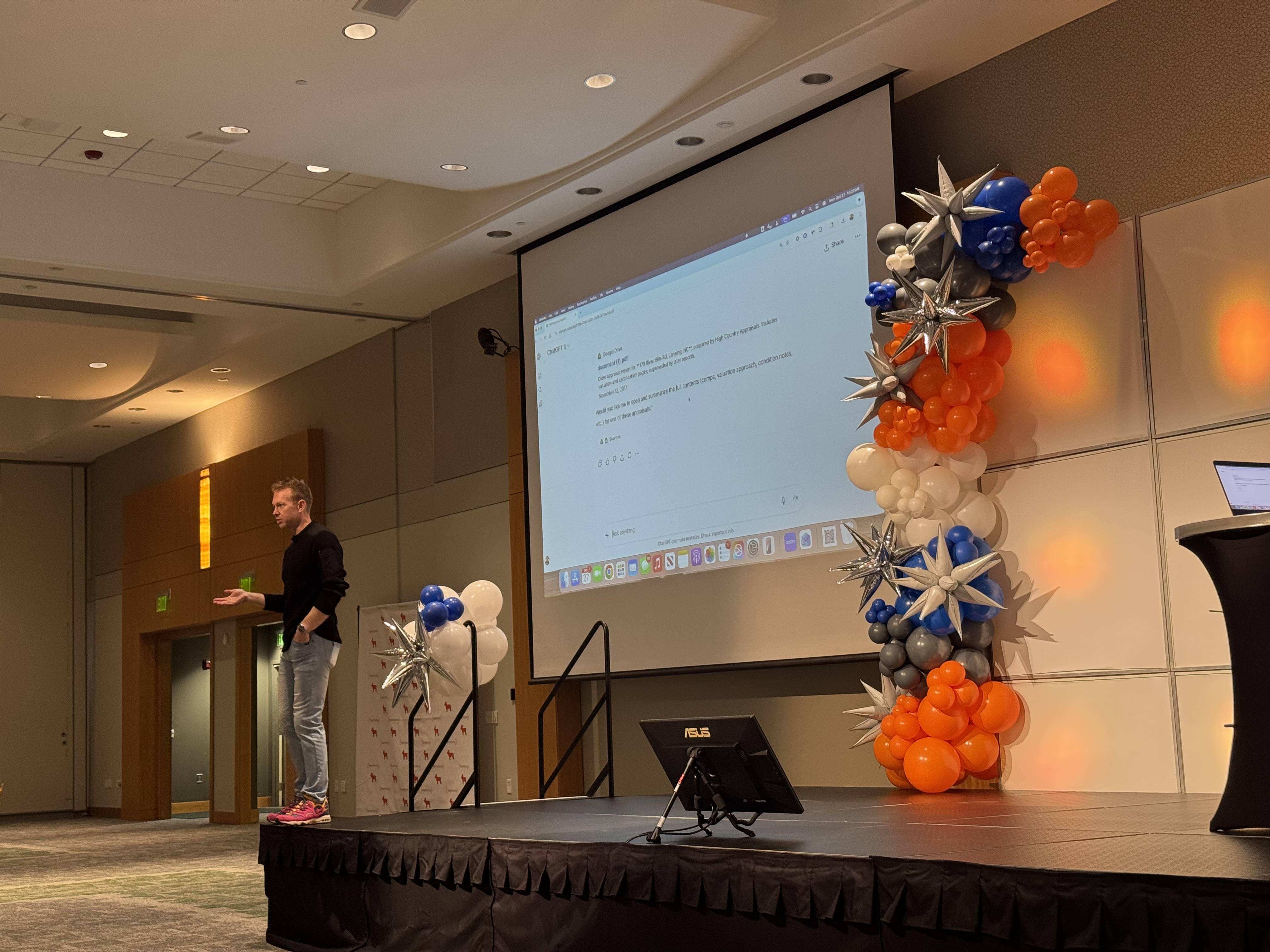 David on stage at a conference